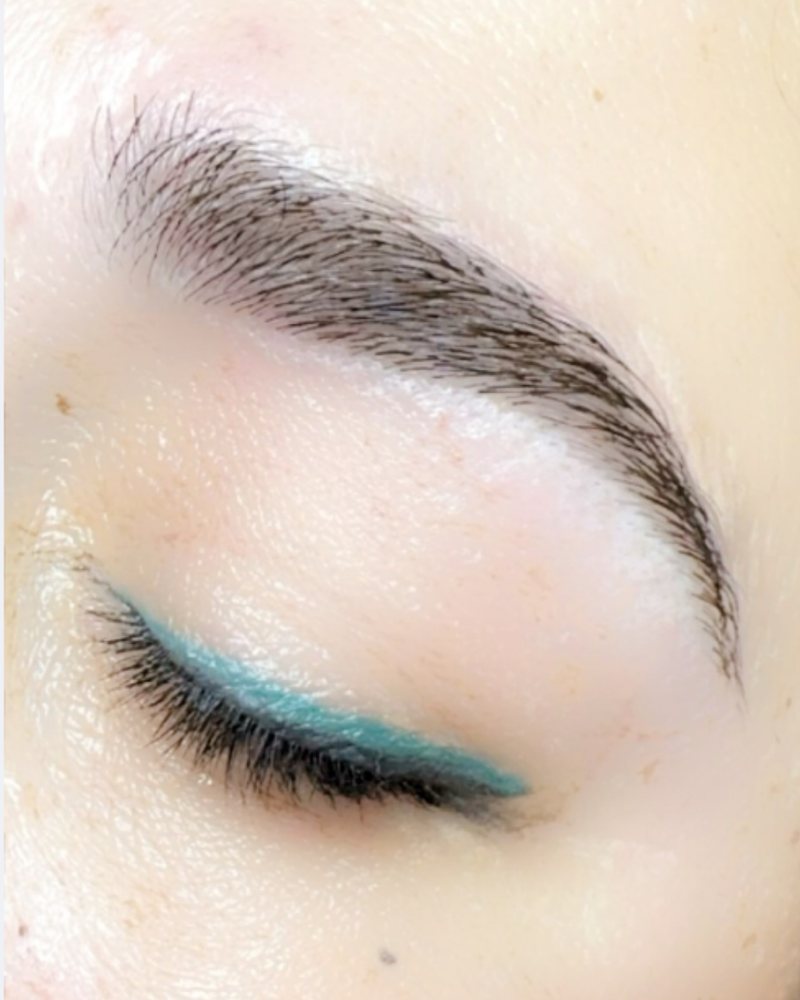 Teal permanent eyeliner, eye closed